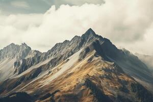 high mountain landscape images covered with snow and clouds photo