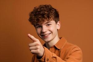 Portrait of a young man pointing his finger at the camera photo