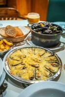 Traditional Belgian steamed mussels, mussels with cheese photo