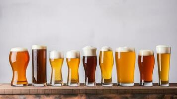 Variety of full frothy lager glasses and sizes top view photo