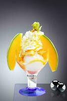 Delicious ice cream with melon and papaya. Healthy summer food concept. photo