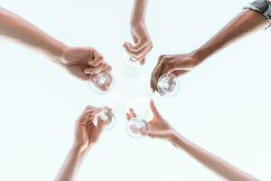 Friends have a picnic and toast with wine photo