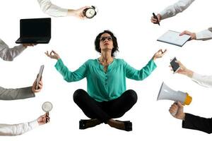 businesswoman does yoga exercise to relax himself from business life photo