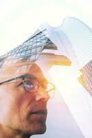 Double exposure with senior businessmen at working photo