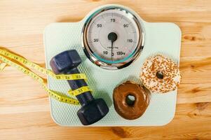 Scale for measuring weight after exercise in the gym photo