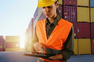 Woman works as a warehouse worker in a cargo warehouse photo