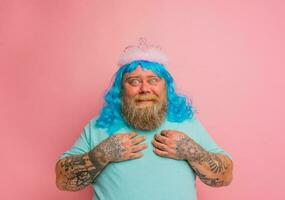 Fat amazed man with tattoos acts like a princess photo