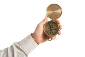 businessman holds a compass to help himself to find the correct way photo