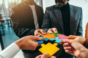 Teamwork of partners connect puzzle pieces as integration and startup photo