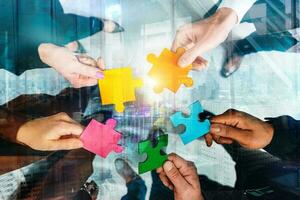 Teamwork of partners connect puzzle pieces as integration and startup photo