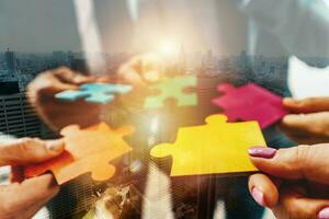 Teamwork of partners connect puzzle pieces as integration and startup photo