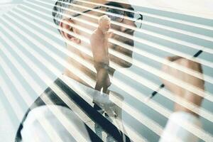 Double exposure with senior businessmen at working photo