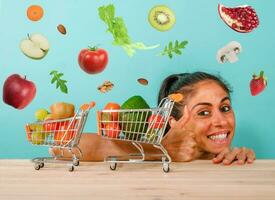 Happy woman made an healthy shopping of fruit photo