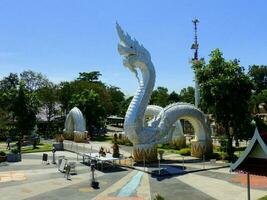 A large white Naga statue or King of Nagas at Kaeng Kabao, Mukdahan photo