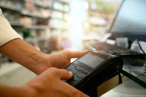 Shop payment by contactless creditcard and POS in a store photo