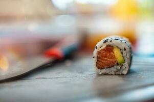 Close up of tasty japanese uramaki sushi with salmon photo