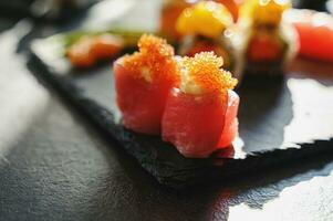 Close up of tasty japanese uramaki sushi with salmon photo