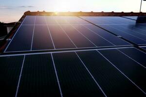 Renewable energy system with solar panel on the roof photo