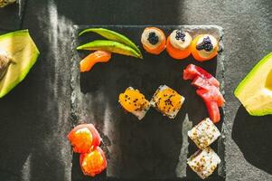 Close up of tasty japanese uramaki sushi with salmon photo