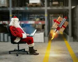 Santa claus delivers online orders from a laptop photo