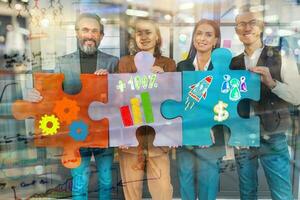 Teamwork of partners connect puzzle pieces as integration and startup photo