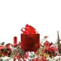 Christmas background concept. Shimmering Christmas decorations with gift, tree, Santa Claus and candles photo