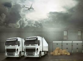 White trucks in the forecourt of an interchange port ready to load the goods and reach the destinations. International shipping logistics concept photo