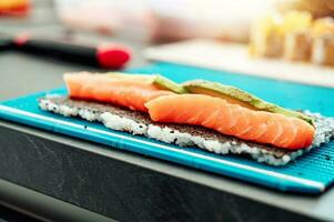 Close up of tasty japanese uramaki sushi with salmon photo