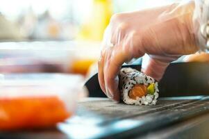 Close up of tasty japanese uramaki sushi with salmon photo