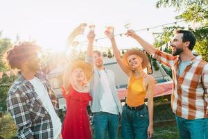 Friends have a picnic with a camper in a sunny day photo