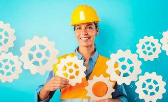 Engineer woman joins pieces of gears as concept of partnership and integration photo