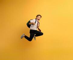 Young boy student runs fast to escape from school. Yellow background photo