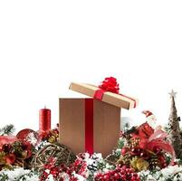 Christmas background concept. Shimmering Christmas decorations with gift, tree, Santa Claus and candles photo