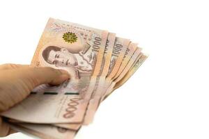mano participación tailandés divisa, 1000 baht, dinero billete de banco de Tailandia foto