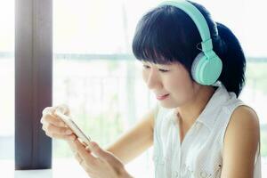 Asian woman staying and working at home photo