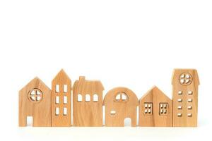 Wooden house model on white background photo