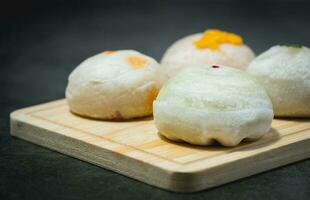 Traditional Chinese pastry on wooden plate photo