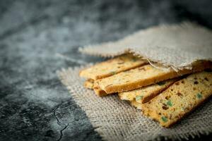 Homemade delicious biscotti on dark background photo