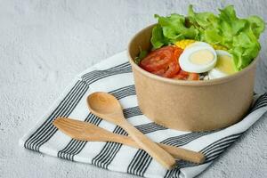 Fresh salad vegetable with boiled chicken egg photo