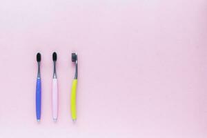 Toothbrush on pink background photo