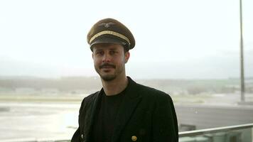 Airline pilot captain working at airport terminal in a uniform video