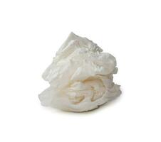 Single screwed or crumpled tissue paper or napkin in strange shape after use in toilet or restroom isolated on white background with clipping path. photo
