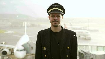 Airline pilot captain working at airport terminal in a uniform video