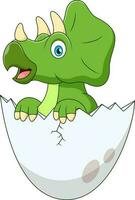 Cute triceratops mascot cartoon hatching from an egg vector