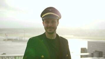 Airline pilot captain working at airport terminal in a uniform video