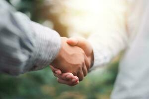 Businessmen shaking hands to indicate a business deal,successful contract management of the company,signing an agreement,business partner,New opportunities for the future of the industry,joint venture photo