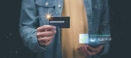 A man using credit card to make financial transactions via smartphone, payment concept with wireless communication technology, consumer safety and cashlessness ,Online payment shopping ,e-commerce photo