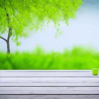 Empty wooden table with blurred green garden background. For product display. photo