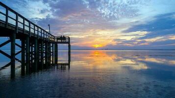 Beautiful sunset over Mobile Bay on the Alabama Gulf Coast photo