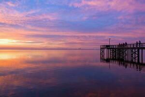 Pier at sunset on Mobile bay photo